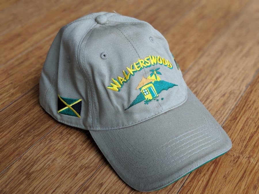 A grey hat with the word jamaica on it.