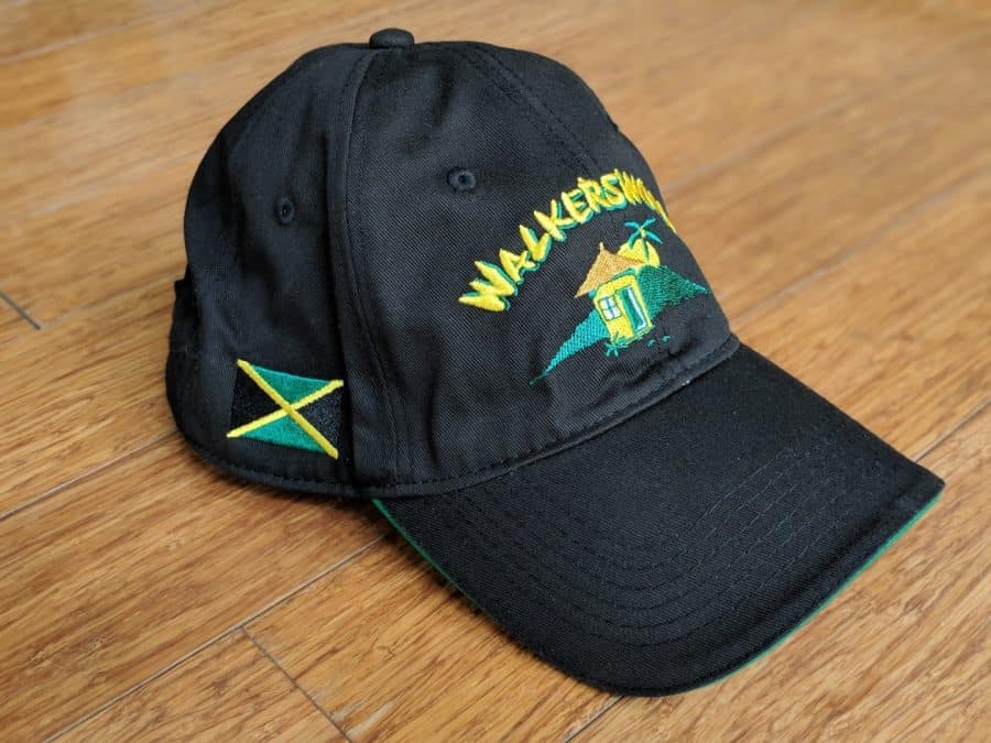 A black hat with the word jamaica on it.