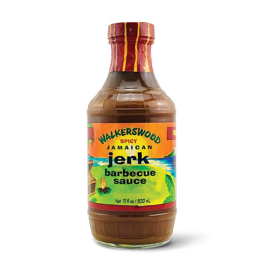 A Walkerswood Jerk Barbecue Sauce bottle on a white background.