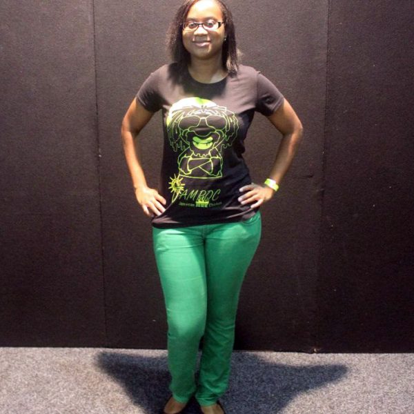 A woman wearing a green Jamroc T-Shirt.